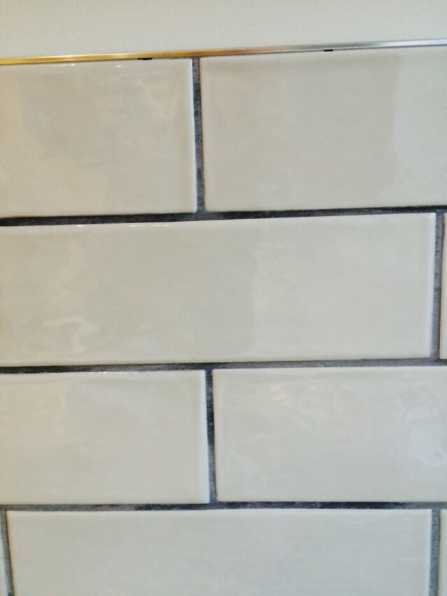 Subway tiles with grey grout and trim