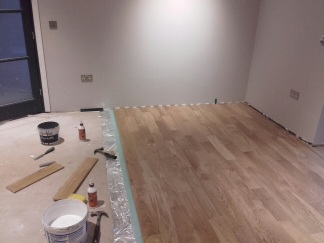 The wooden floor being laid, with the layers beneath.