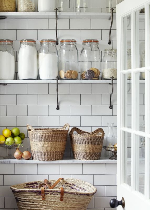 Walk in pantry with shelves and storage jars
